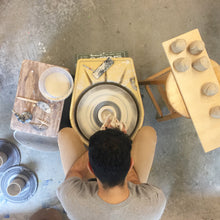 Load image into Gallery viewer, Farbod Nael throwing in pottery studio 